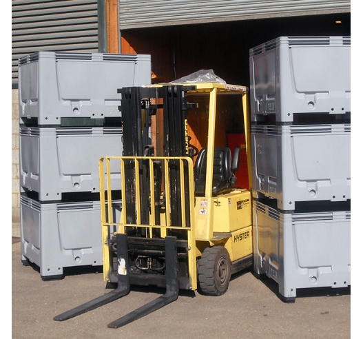 Pallet boxes stacked and moved by forklift truck