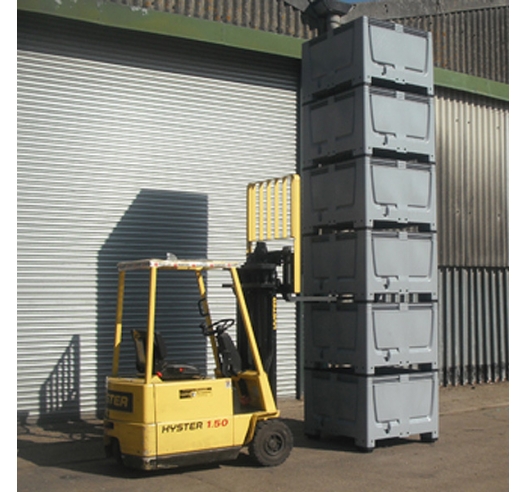 Jumbo sized containers known as pallet boxes stacked and moved by forklift truck