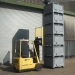 Jumbo sized containers known as pallet boxes stacked and moved by forklift truck
